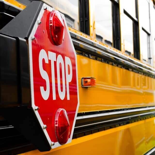 stop sign closed on a school bus